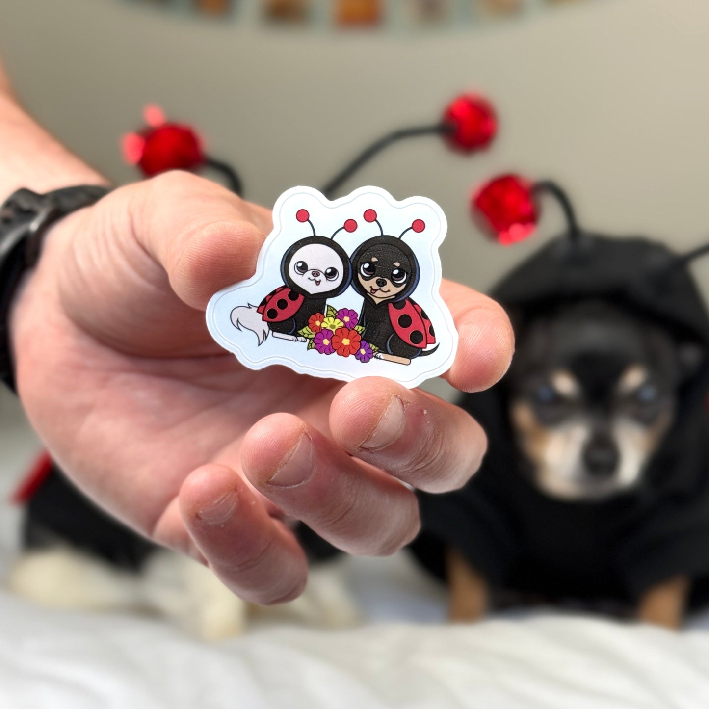 Cedric and Maya showcasing their ladybug costume sticker.