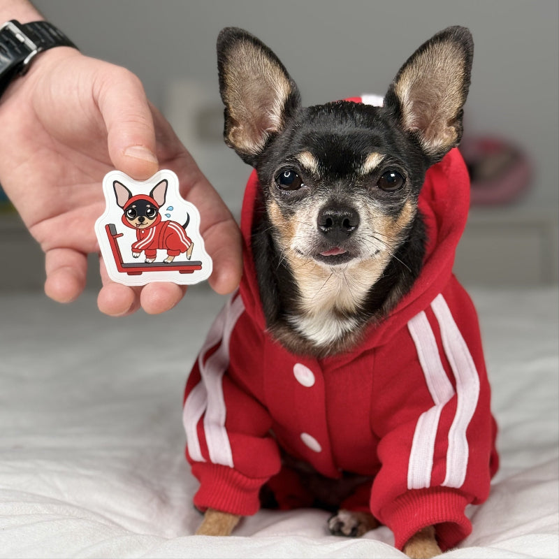 Dog wearing a red hoodie with white stripes, holding a sticker of a dog in a similar outfit.