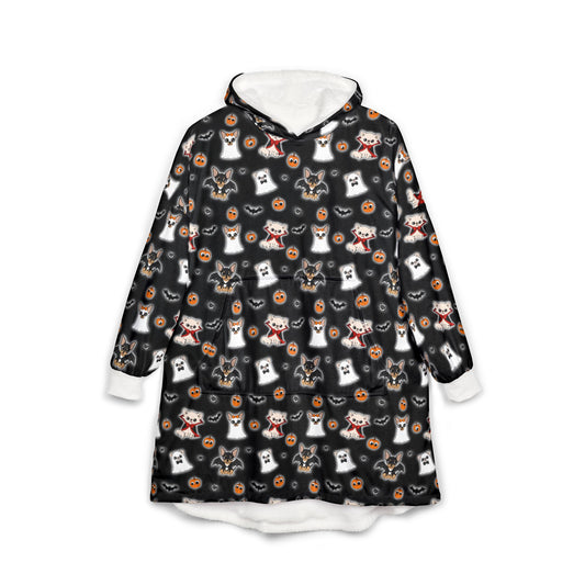 Front view of a black wearable hooded blanket covered in the Halloween Chis pattern, with a white lined hood and cuffs.
