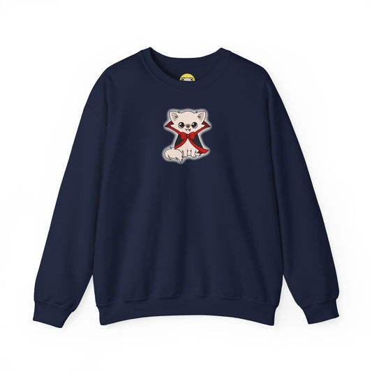 Front view of a navy crewneck sweatshirt featuring a centered illustration of Cedric, a cream chihuahua sitting in a black cape with red lining and a red bow, outlined by a soft white glow.