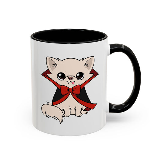 White ceramic mug with black handle and interior, featuring a front-view cartoon chihuahua sitting calmly in a black cape with red lining and a red bow tie, tiny fangs showing in a gentle smile.