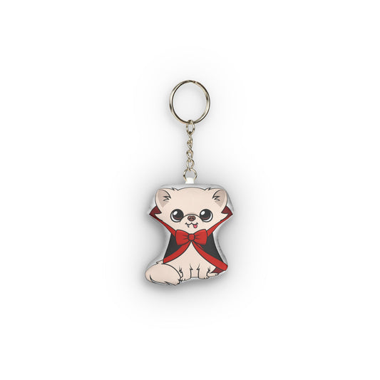 Vampire Cedric mini plush keychain wearing a black cape with red lining.