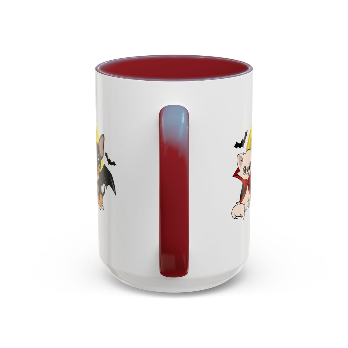 White accent coffee mug with a maroon handle and interior, showing partial cartoon chihuahuas in vampire costumes on each side of the handle against a moonlit Halloween scene with small bats.
