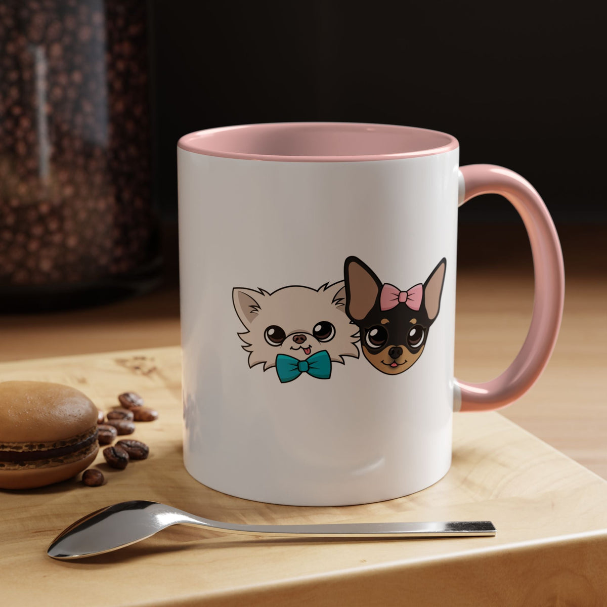 White mug with a pink handle and interior, illustrated with Cedric and Maya.
