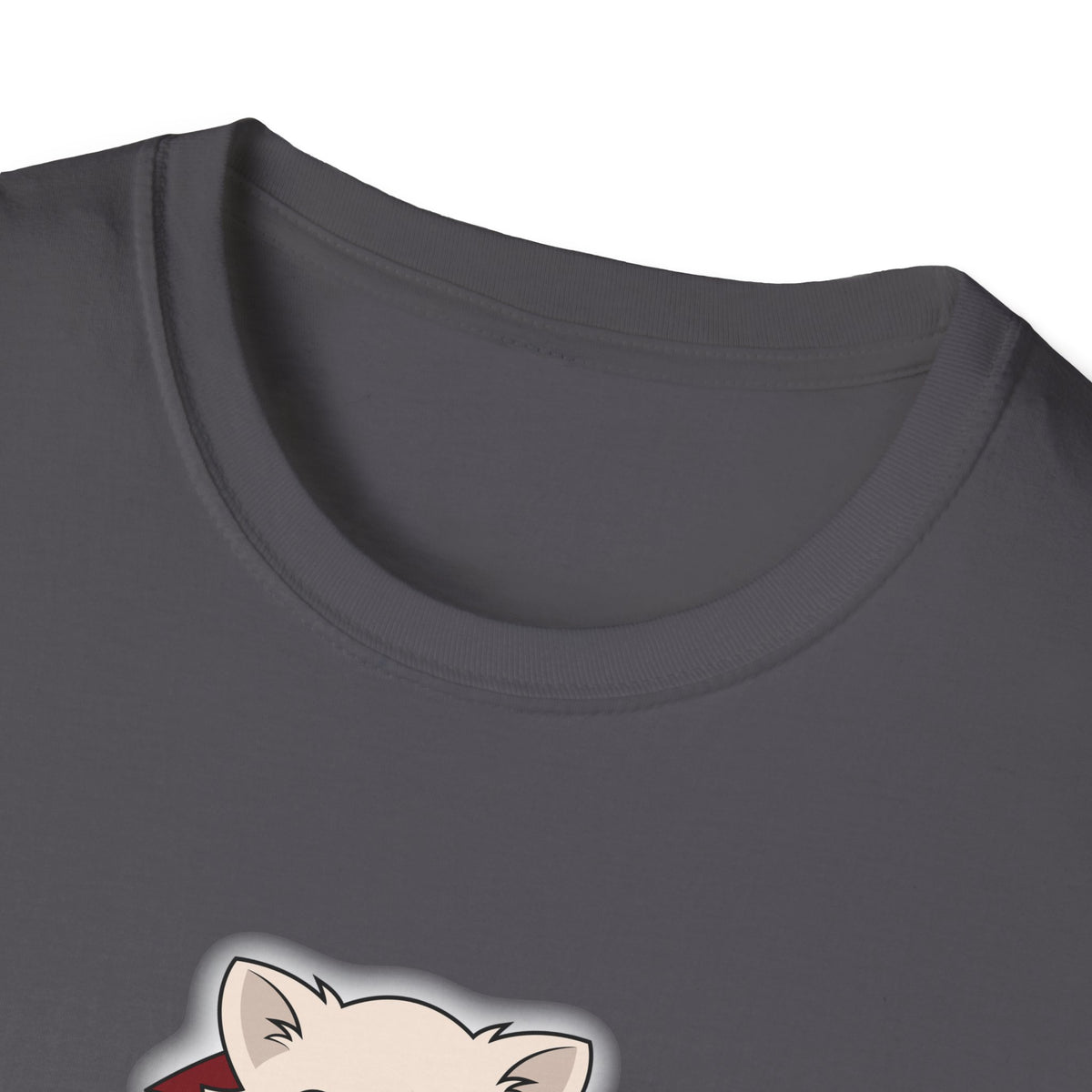 Person sitting cross-legged on a living room rug wearing a charcoal unisex t-shirt with a cute cream chihuahua illustration dressed in a black cape with red lining and a red bow, shown from the front.