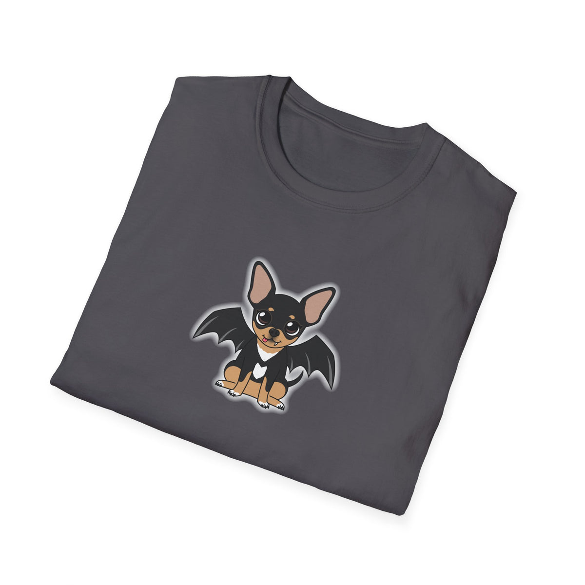 Woman sitting cross-legged on a living room floor wearing an orange t-shirt with a cute black-and-tan chihuahua character with bat wings printed on the chest.