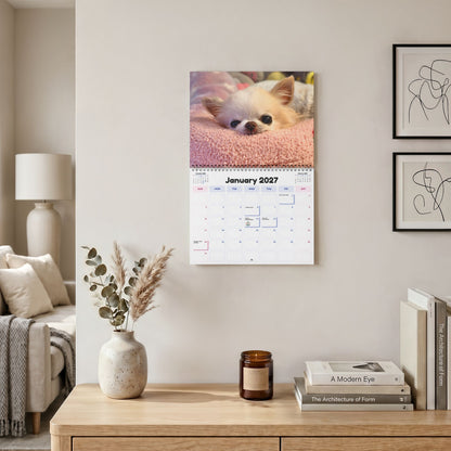 Cedric and Maya's 2027 calendar hanging above a desk, open to its January page.