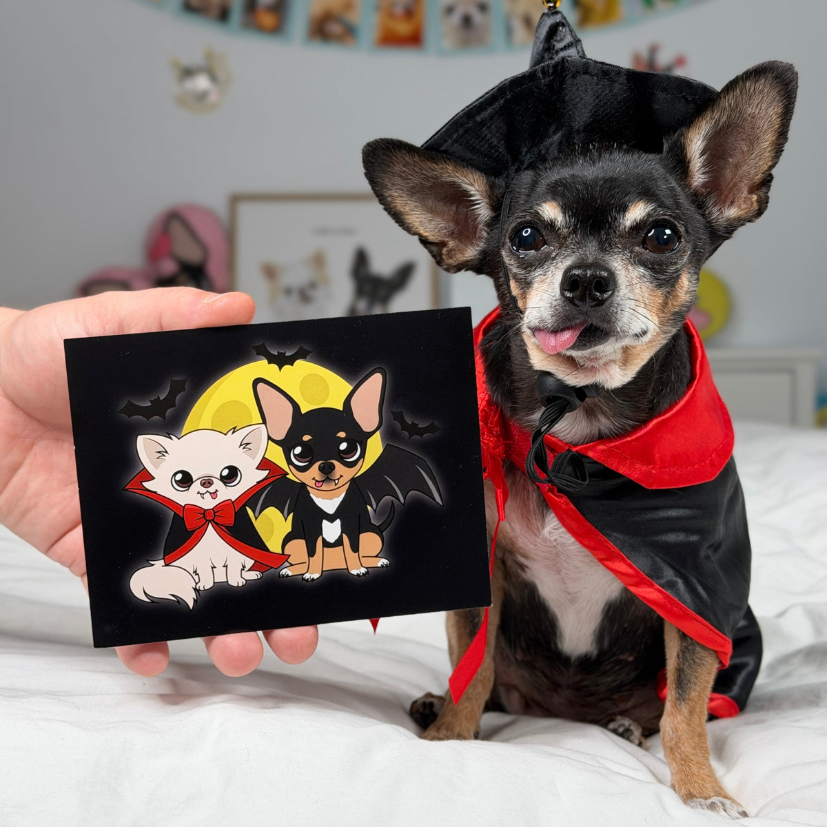 The Vampire Chis Pawdograph photo held up beside Cedric and Maya.