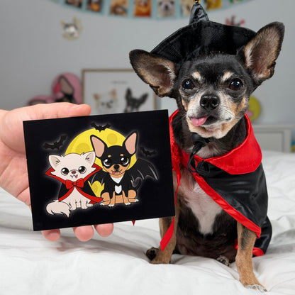 The Vampire Chis Pawdograph photo held up beside Cedric and Maya.