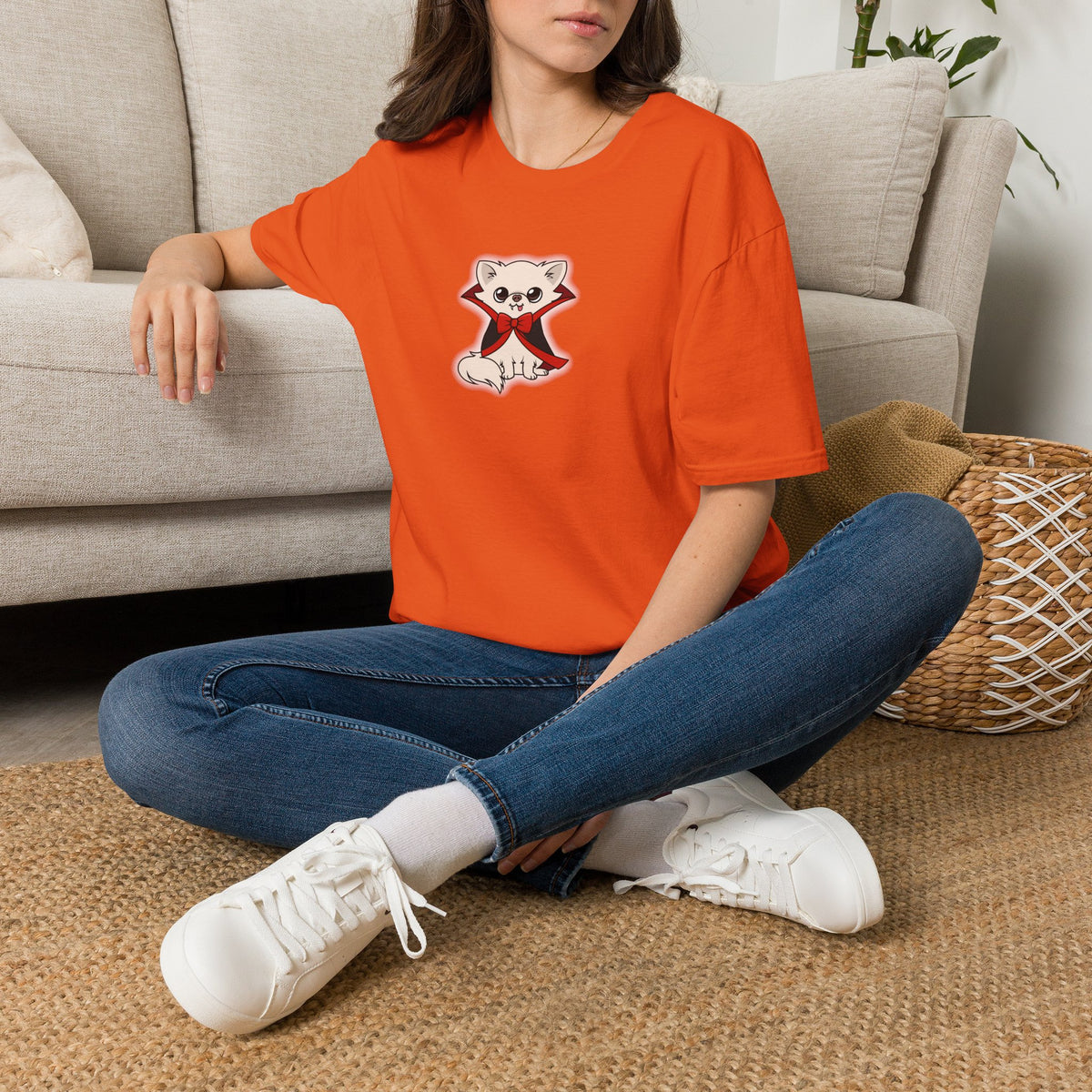 Gildan 64000 unisex t-shirt size chart showing a blank short-sleeve crew neck tee with labeled width, length, and sleeve length measurements above a table listing sizes and dimensions in inches and centimeters.