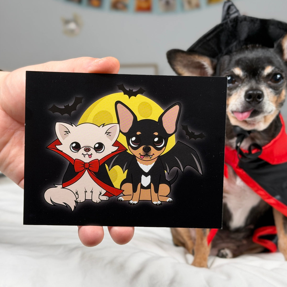 Pawdograph photo artwork featuring Cedric and Maya together in vampire costumes.