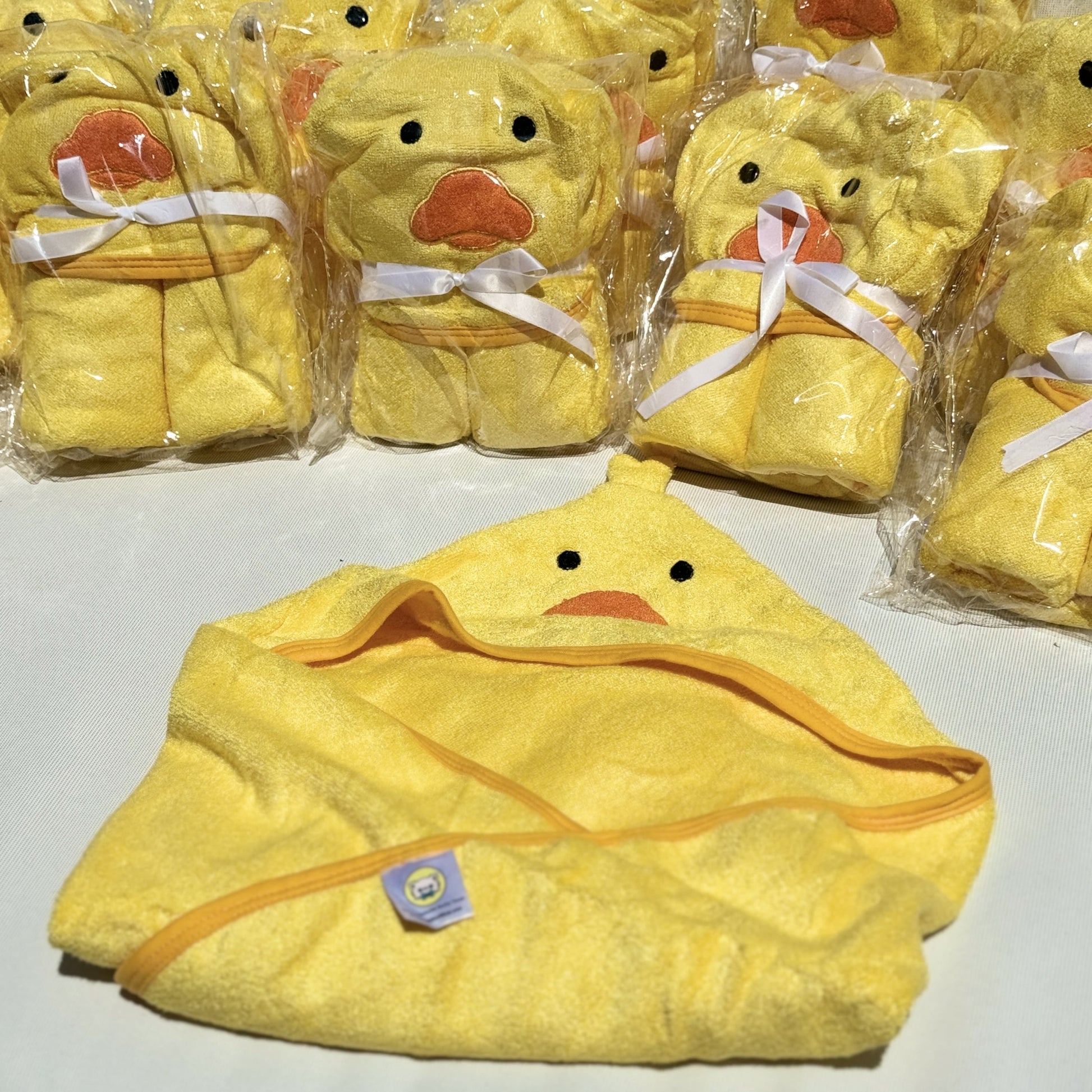 Ducky Towel Folded in front of a bucnh of ducky towels