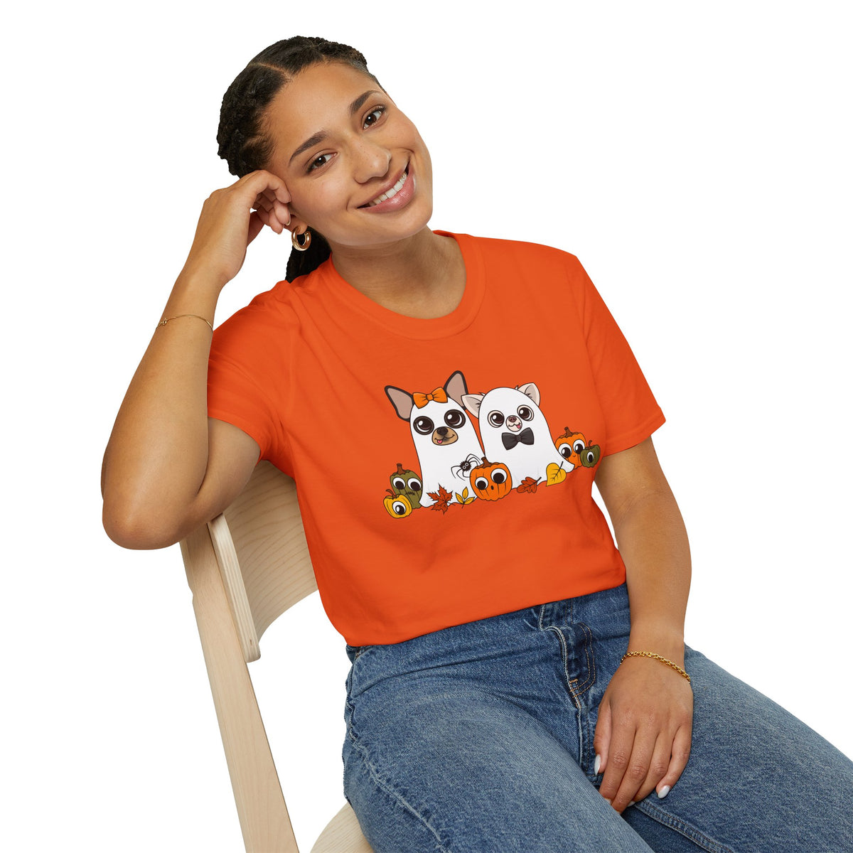 Woman seated indoors wearing the orange Boo Crew T-shirt.