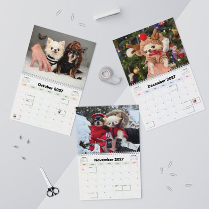 Flat lay showing October, November and December 2027 calendar pages with colorful seasonal grids.