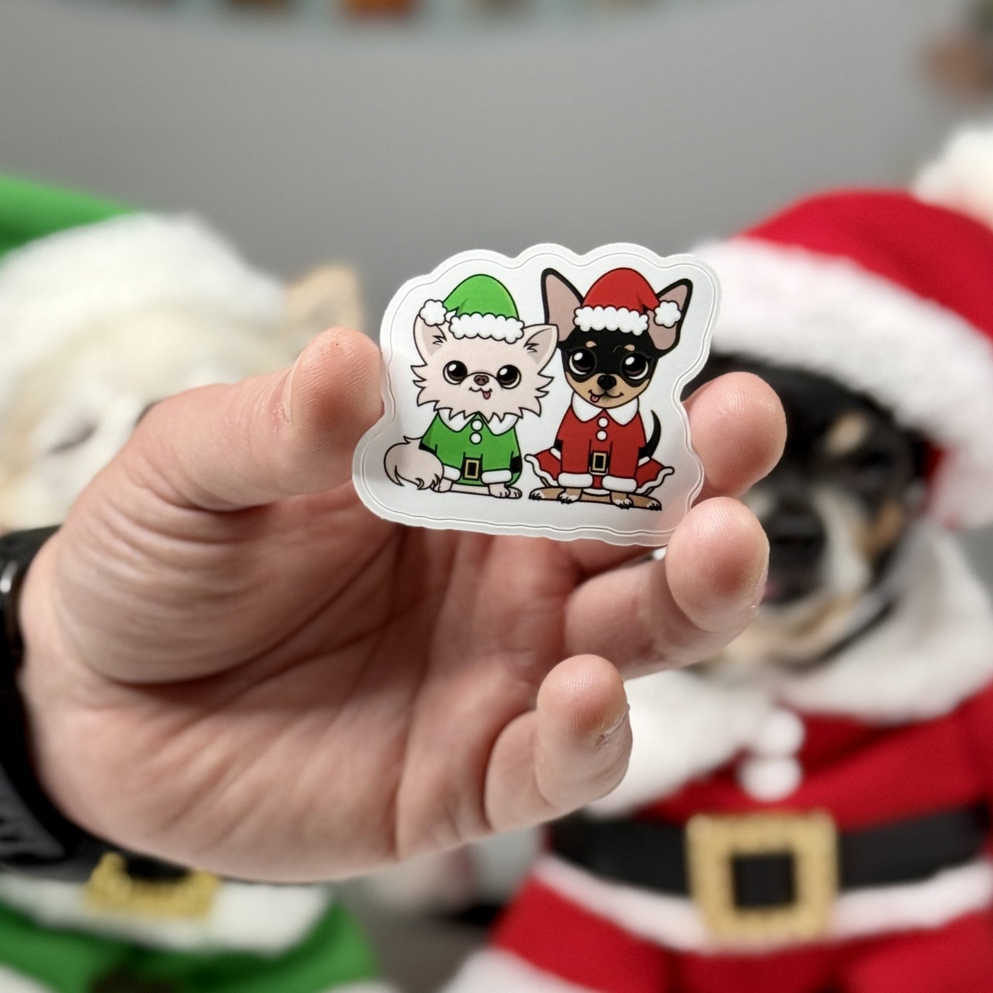 Elf Cedric and Santa Maya Sticker featuring two Chihuahuas in festive elf and Santa costumes, perfect for Christmas decorating and gifts.