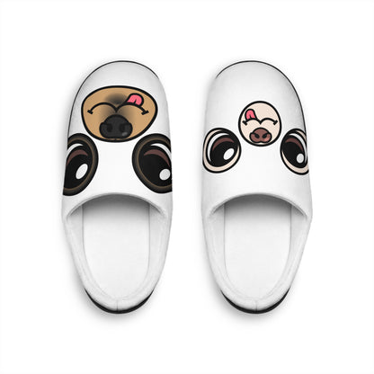Pair of white women’s indoor slippers with Ghost Chis faces printed on the footbeds and black soles.