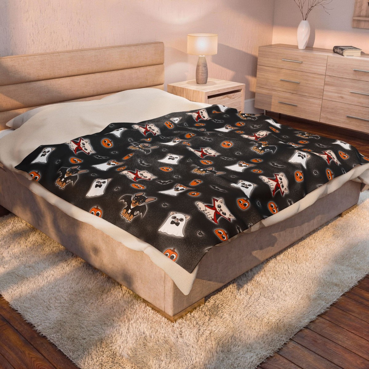Halloween Chis printed blanket styled across a bed in a warm bedroom.