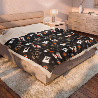 Halloween Chis printed blanket styled across a bed in a warm bedroom.