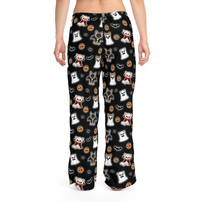 Back view of a model wearing black Halloween pajama pants with an all-over Chihuahua character pattern.