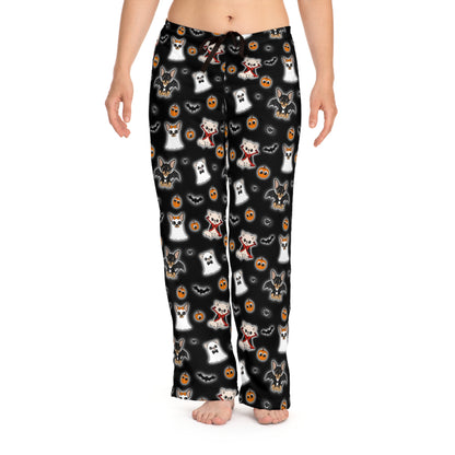 Model wearing black Halloween pajama pants covered in a repeating Chihuahua, pumpkin and bat pattern.