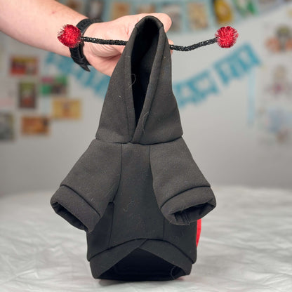 Detailed view of the black hoody design of Maya’s ladybug costume for small dogs.