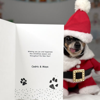 Maya showing off the inside of the  Pawdographed Chihuahua Holiday Greeting Card featuring their pawdographs and message.