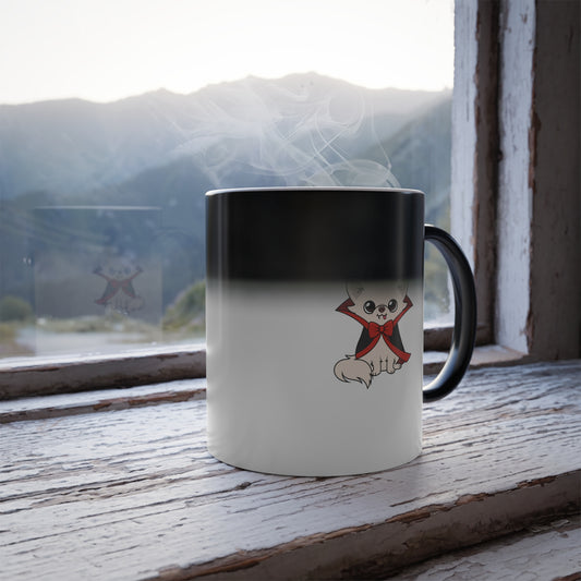 Color-changing mug on a rustic windowsill, fading from black at the top to white at the bottom, with a small cartoon cream chihuahua in a black and red vampire cape and bow near the base.