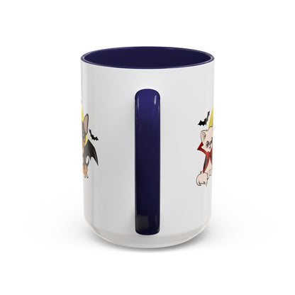 White ceramic mug with a navy blue handle and interior, showing partial cartoon chihuahuas in Halloween vampire outfits on either side of the handle against a white background.