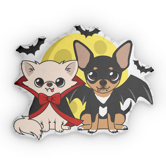 Custom-shaped pillow featuring two cartoon chihuahuas dressed for Halloween in front of a large yellow moon, one cream dog in a red-lined vampire cape and bow and one black-and-tan dog with bat wings, with small black bats flying around them.