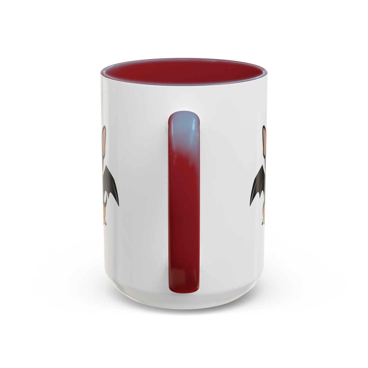 White accent coffee mug with a maroon handle and maroon interior, shown from the back so only partial cartoon bat-winged chihuahua artwork is visible on each side.