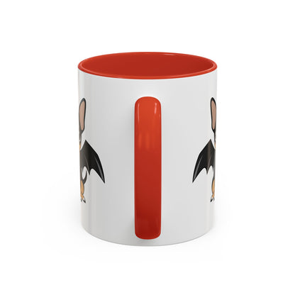 Back view of a white ceramic mug with a red handle and interior, showing partial illustrations of a small bat-winged chihuahua on both sides.